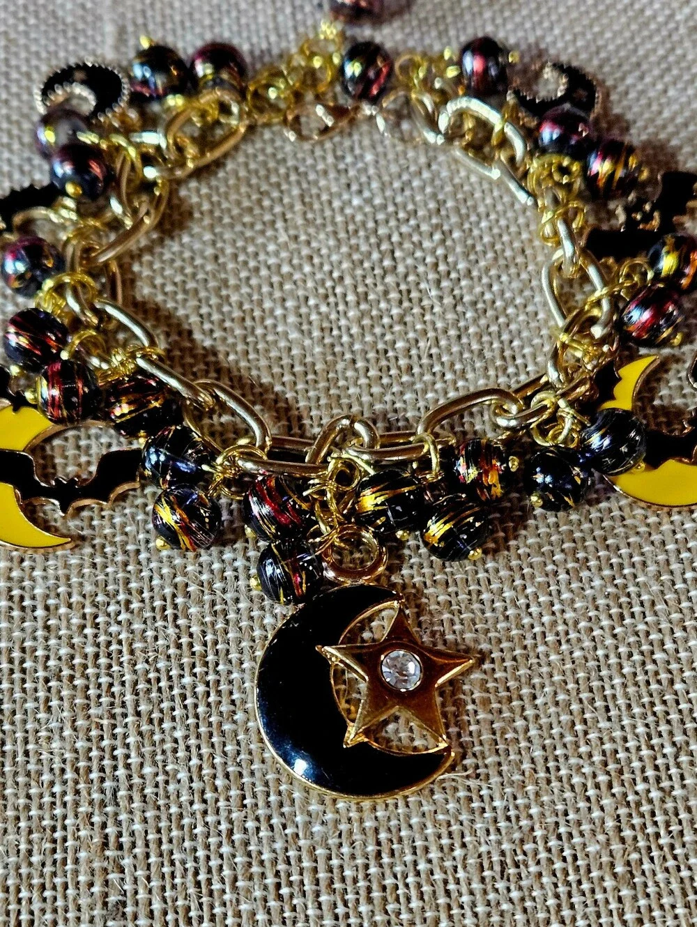 Gold-Tone Moon, Stars And Black Bats Charm Bracelet in Black and Yellow - Picture 7 of 8